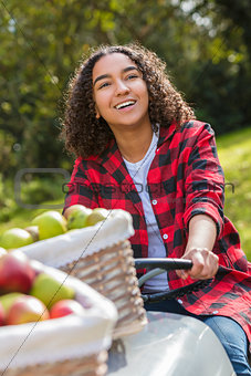Mixed Race Female Teenager Driving Tractor Picking Apples