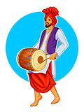 Sikh Punjabi Sardar playing dhol and dancing bhangra on holiday like Lohri or Vaisakhi