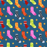 Winter socks with different prints seamless pattern. Christmas sock repeating texture. Endless background. Vector illustration.