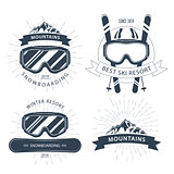 Ski resort emblem and lebels with goggles, mountains - winter sp
