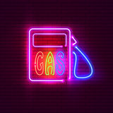 Gas station neon sign on brick wall. Vintage signboard