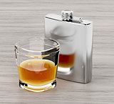 Hip flask and a glass of brandy