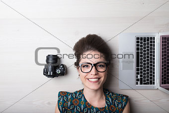 smiling woman is a photographer and graphic designer