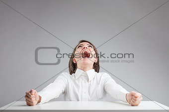 woman with her mouth wide open shouting