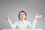 office zen woman relaxing and meditating