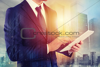 Businessman shares document with tablet. Internet concept