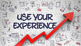 Use Your Experience Drawn on White Wall.
