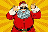 Thumbs up Santa Claus in sunglasses