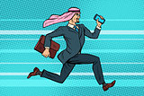 Arab businessman runs forward, phone and briefcase in hand