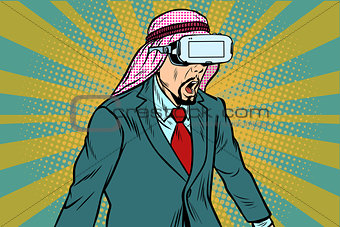 Surprised Arab businessman in VR glasses