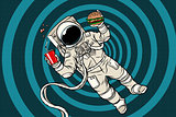 Astronaut in zero gravity with fast food