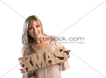 Festive smiling woman holding Xmas word on white background  Chr