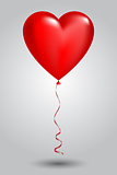 Red balloon in form of heart on light background
