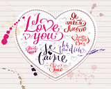 I love you text in English, Spanish, French, German and Russian. Heart shape symbol of love from white paper. Valentine Day greeting card calligraphy