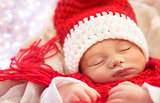 Sweet baby sleeping in Christmas costume