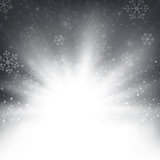 Christmas snowflakes and snows with sunburst in blue background