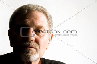 Close up on the face of a baby boomer - Isolated