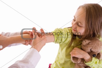 Little girl getting an injection-studio shot