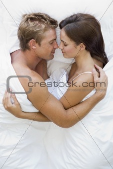 Young Couple In Bed
