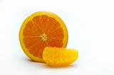 Half an orange with a segment on white room for text on the side