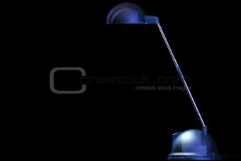 Blue transparent desk-lamp on black