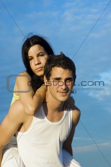 Teen couple in piggy back