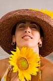 Hispanic beauty holding sunflower