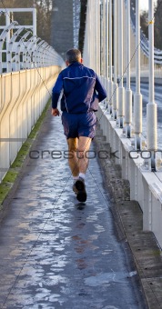 Runner on a Clifton suspension bridge