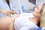 Pregnant woman doing ultrasound scan