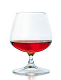 A glass of cognac on a white background