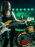 Beautiful women playing in the rock band