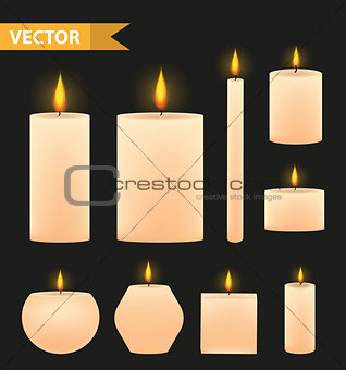 Realistic beige candles set. 3d burning candle collection. Isolated on a black background. Vector illustration.