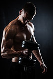 Athletic male with dumbbells