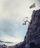Reach the flag. Achievement business goal and difficult career concept