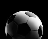 Soccer or football ball in the backlight on black background. Vector close-up illustration