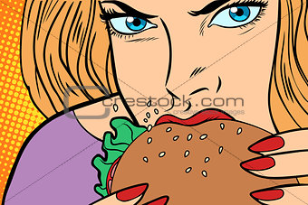 Hungry woman eats Burger