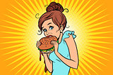Overeating fast food. Woman secretly eating a Burger