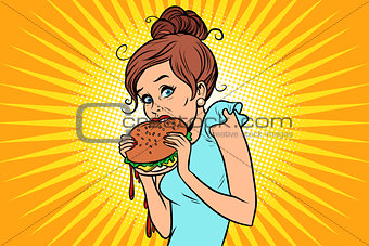 Overeating fast food. Woman secretly eating a Burger