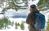 Traveler man in the snowy mountains