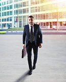 Determinated businessman walking in the city