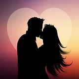 Silhouette of couple kissing on a heart background
