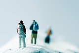 miniature hikkers in a snowy landscape
