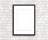 3D blank picture hanging on a brick wall