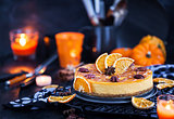 Delicious pumpkin and orange cheesecake decorated with caramel s