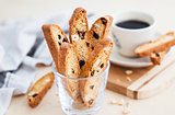 Italian cranberry almond biscotti  and cup of coffee on backgrou