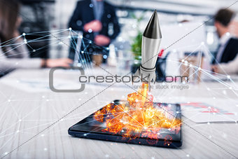 Rocket ready to starts from a tablet. concept of company startup