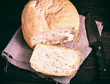 round yeast bread and a kitchen knife 