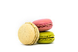 Delicious three multicolored macaroon on a white background