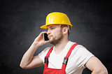 Construction worker using smartphone