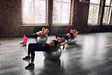 Girls working out at a gym with the gymball